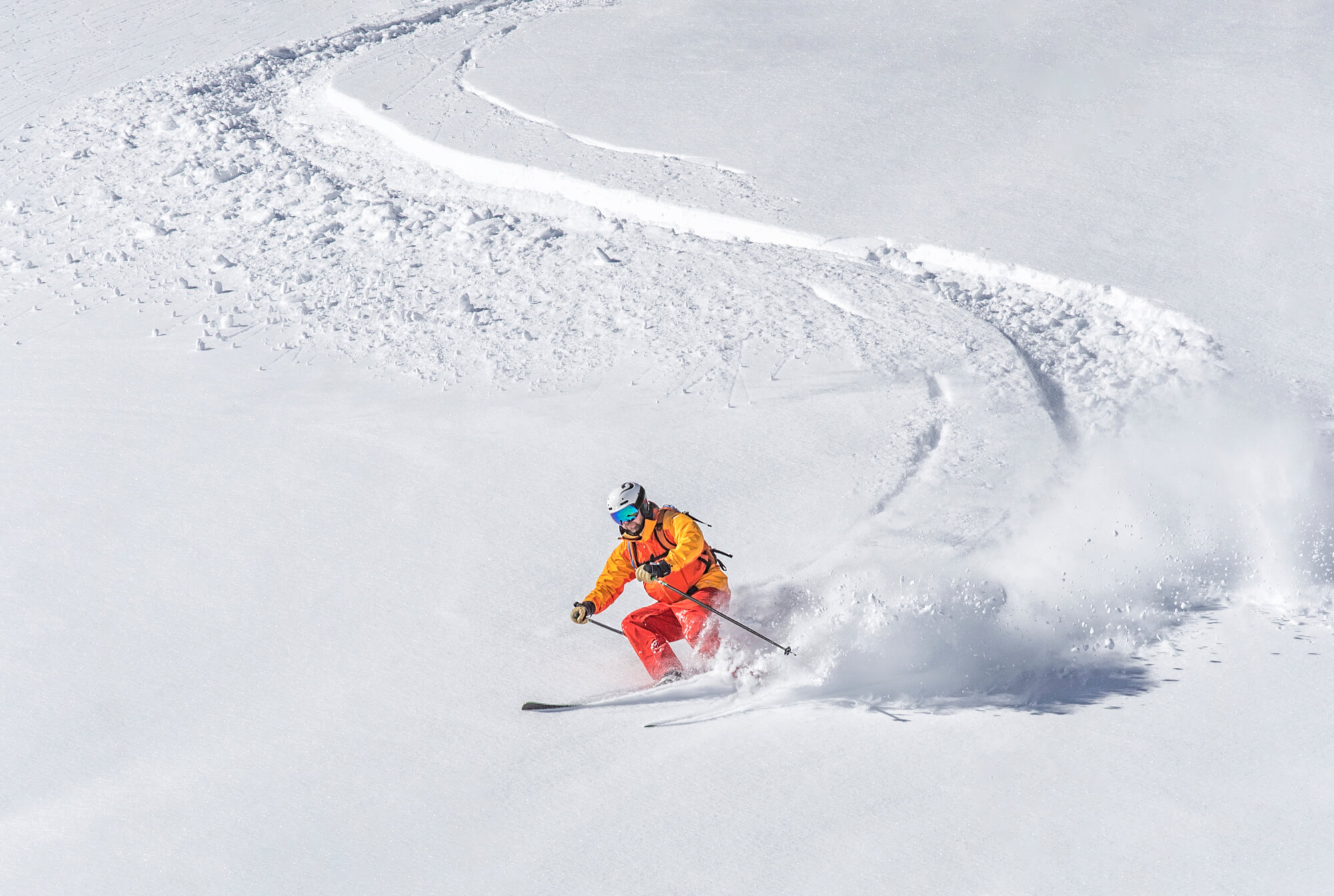 Skier freerides in deep snow
