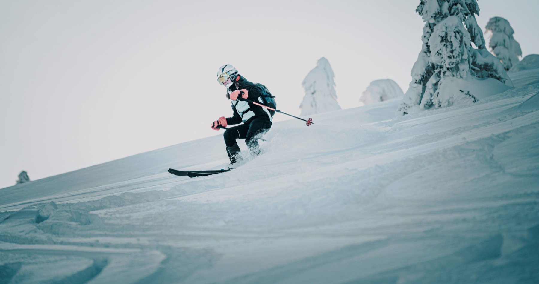 Ski tourer skiing in deep powder