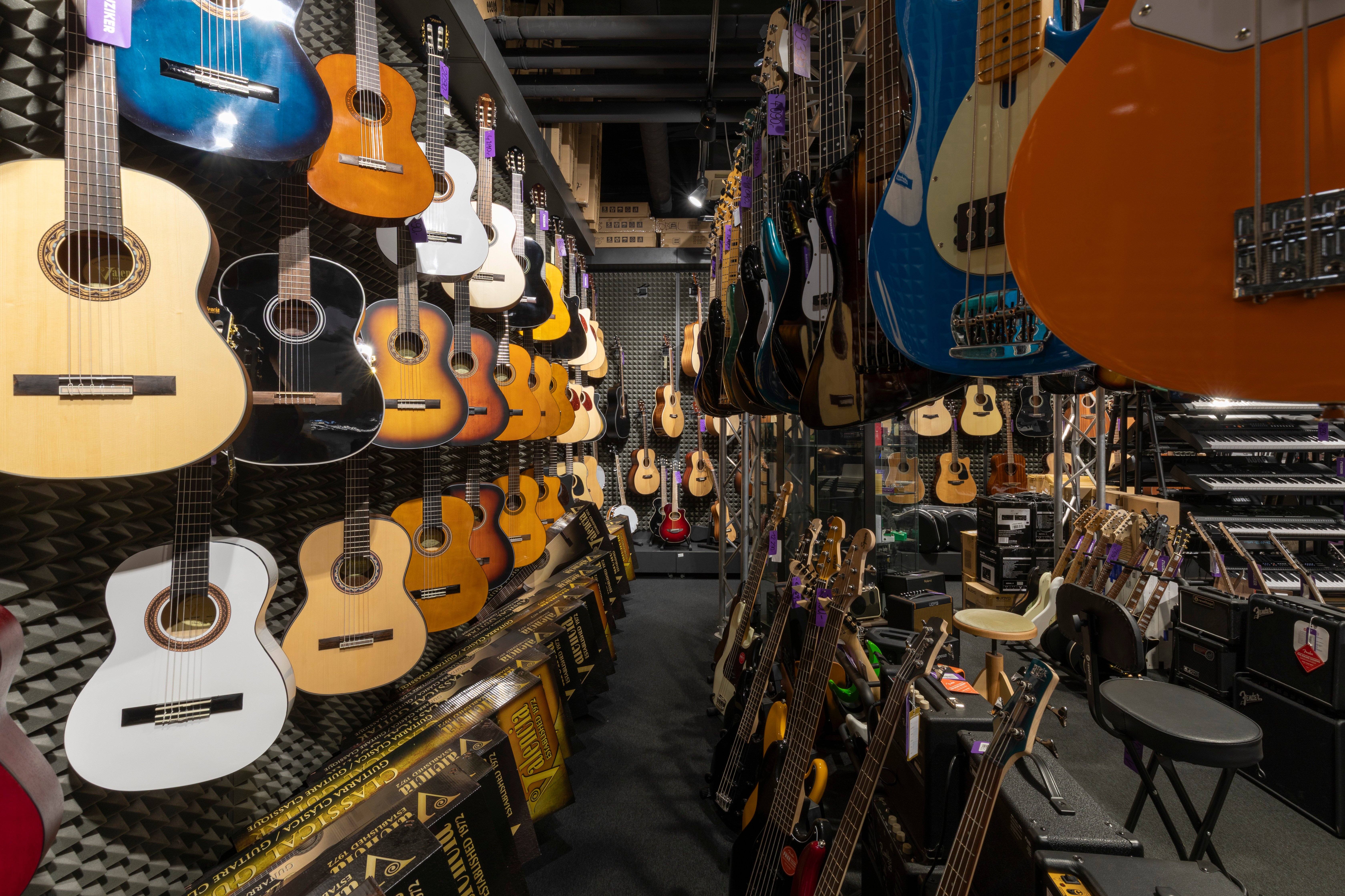 Guitars in musical instruments shop Muziker Liberec.